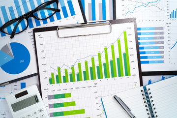 Poster - Growth strategy planning. Preparing and analyzing business reports. Pile of reports and office supplies.
