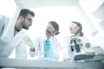 Group of scientists working on an experiment at the laboratory