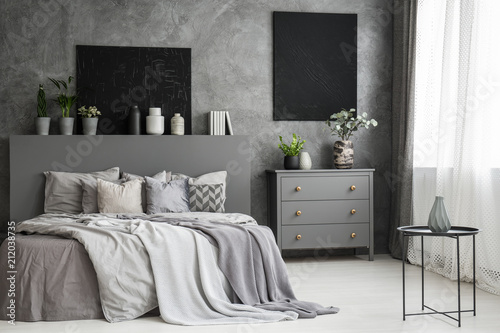 Moon Canvas On A Grey Wall In A Monochromatic Cozy Bedroom