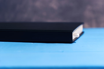 Poster - Daily planner on a blue wooden table.