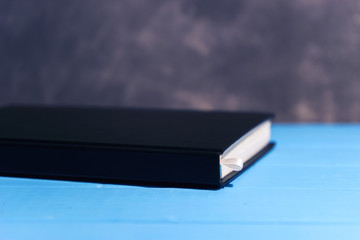 Poster - Daily planner on a blue wooden table.