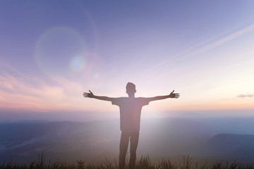 Canvas Print - Happy man rise hand on morning view. Christian inspire praise God on good friday background. Now one man self confidence on peak open arms enjoying nature the sun concept world wisdom fun hope.