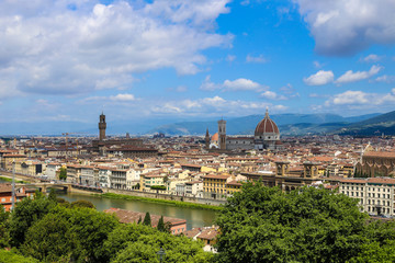 Beautiful summer cityscape of Florence with clouds in background, Italy. Concept of italian photos for postcards and last minute tours to Europe.