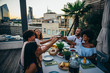 © oneinchpunch - Group of friends having fun on the rooftop of a beautiful penthouse