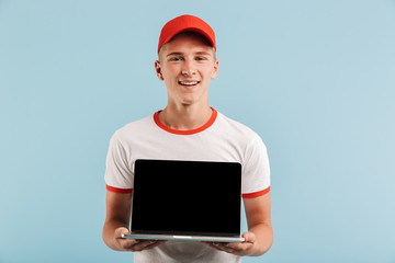 Canvas Print - Portrait of a smiling casual teenage boy in red cap