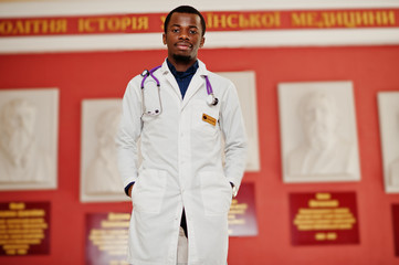 Wall Mural - African american doctor student male at lab coat with stethoscope inside medical university.