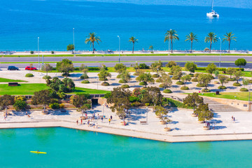 View of Parc de la Mar (Park of the Sea) with the sea in the background from the terrace of the Cathedral of Santa Maria of Palma, also known as La Seu. Palma, Mallorca, Spain