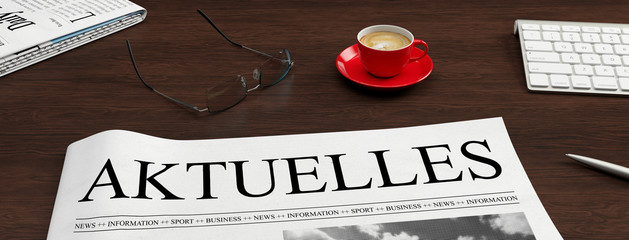 Wall Mural - Zeitung mit Aktuelles Schlagzeile auf Schreibtisch