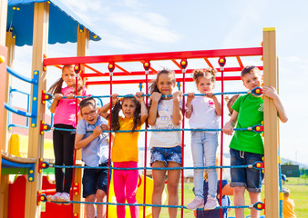 Group of children climbing the net