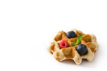 Wall Mural - Traditional belgian waffles with blueberries and raspberries isolated on white background. Copyspace