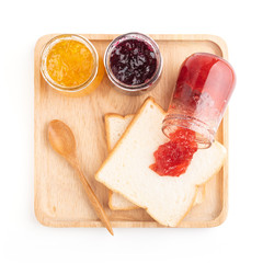 Wall Mural - Toast sandwiches with strawberry, orange and blueberries jam isolated on white background, top view