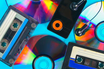 The concept of the evolution of music. Cassette, CD-disk, mp3 player. Vintage and modernity. Music support.