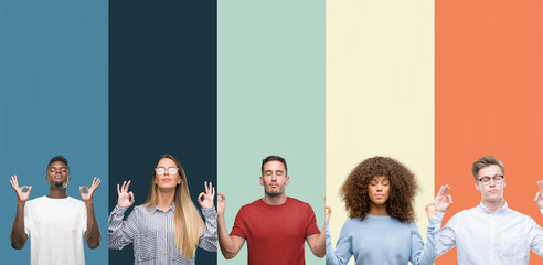 Wall Mural - Group of people over vintage colors background relax and smiling with eyes closed doing meditation gesture with fingers. Yoga concept.