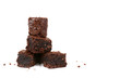 fresh baked brownies in a pile isolated white background