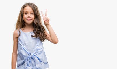 Brunette hispanic girl showing and pointing up with fingers number two while smiling confident and happy.