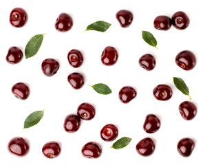 Wall Mural - Red cherries and leaves scattered on a white, top view. Fruit background.