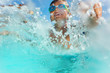 © Sergey Novikov - Happy boy having fun splashing water in the pool