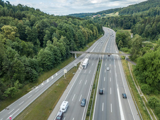  Aerial view of highway bridge in forest in Switzerland, Europe