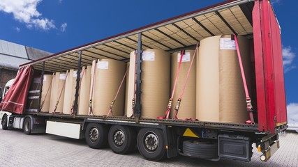  There is a loading to the truck trailer  . Truck Trailer . Cargo truck at warehouse building . Truck in unloading in warehouse