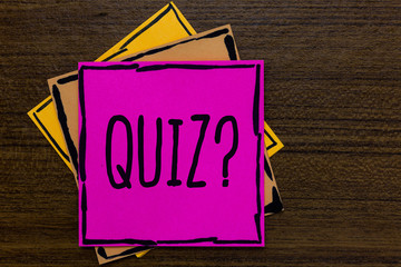 Writing note showing Quiz Question. Business photo showcasing Short Tests Evaluation Examination to quantify your knowledge Three art small paper two yellow one pink wood brown lite grey shadow.