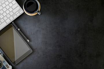 office leather desktop with computer, tablet and vintage camera.