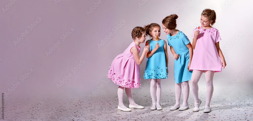 Group little girl in beautiful pink,blue dresses.Four children advertise  clothes for clothing catalog.Studio,pastel background banner,copy space for  text,shop,advertising. Concept fashion models kids. Stock Photo | Adobe  Stock