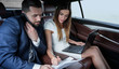 © ASDF - Confident businessman talking on the phone in car