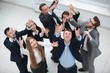 © ASDF - view from the top. joyful business team hands up