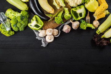 Many different of green ripe vegetables on wooden background. Copy space