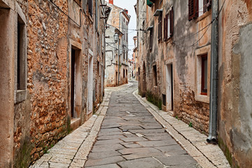 Wall Mural - Vodnjan, Istria, Croatia: old alley in the town near Pula