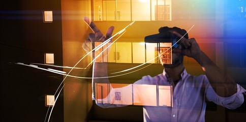 Poster - Composite image of man using a virtual reality device