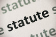© aga7ta - word statute printed on paper macro