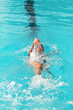 © wibulpas - Swimmer swims backstroke or back crawl in a swimming pool for competition or race