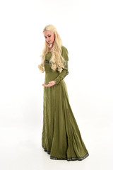 Wall Mural - full length portrait of a blonde girl wearing green medieval gown, stand pose, isolated on white studio background.