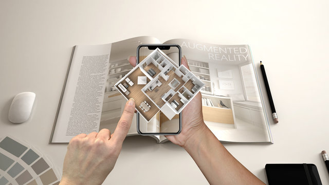 augmented reality concept. hand holding smartphone with ar application used to simulate 3d pop-up in