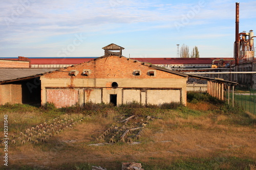 Broken Down Old Industrial Brick Building With Wooden Roof Metal