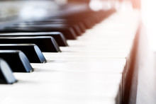 Side View Of Piano Keys. Close-up Of Piano Keys. Close Frontal View. Piano Keyboard With Selective Focus. Diagonal View. Piano Keyboard Perspective. Soft Lighting
