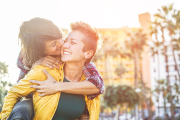 Happy gay couple having fun together outdoor