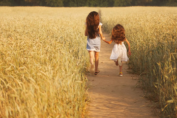 young girl in the yellow field