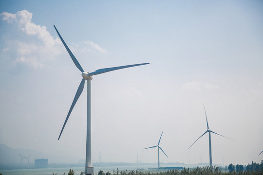 Fototapete - Wind Farm Turbines - Renewable Clean Green Energy. Power Generating Wind Turbines