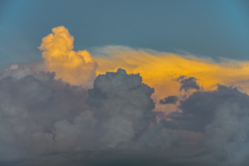Wall Mural - storm clouds brewing at sunset