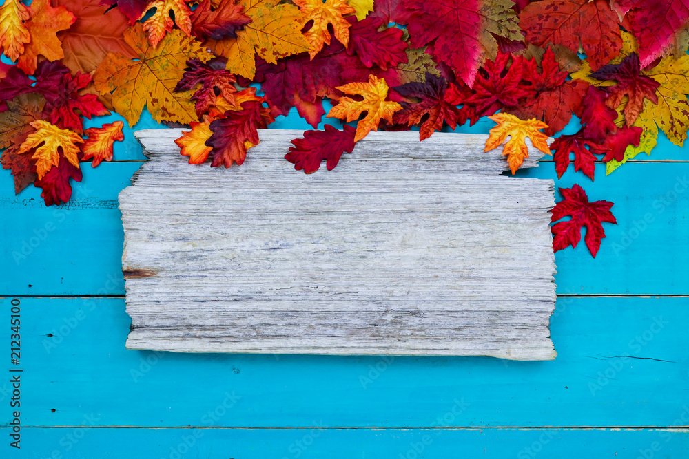 Blank rustic sign with colorful autumn leaves border hanging on antique ...
