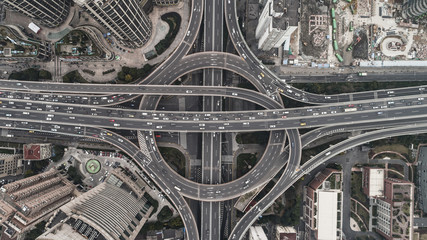 Aerial view of highway and overpass in city on a cloudy day