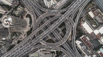 Sticker - Aerial view of highway and overpass in city on a cloudy day