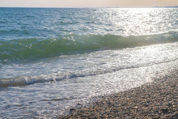 The sea shore at summer Sunny day just before sunset