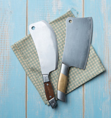 Wall Mural - Old butcher knife on blue wooden background