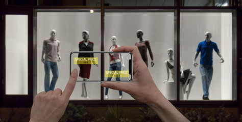 Wall Mural - augmented reality marketing concept. hand holding digital tablet smart phone use ar application to c