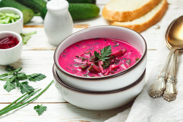 Wall Mural - Cold fresh traditional vegetable summer soup made of beetroot (beet), cucumber, dill, parsley, green onion, eggs and sour cream (kefir). Holodnik. borsch