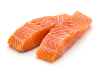 Fresh salmon fillet with basil on the white background.