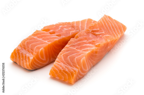 Fotografía Fresh salmon fillet with basil on the white background.